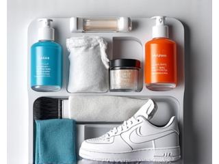 Open premium sneaker care kit with brushes, cleaners, and sprays.